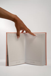 Elevare Collective Notebook open showing blank pages